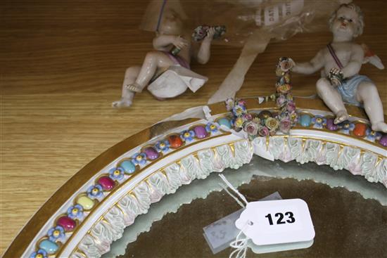 A Meissen porcelain dressing table mirror, surmounted with cherubs (a.f.), overall height 56cm